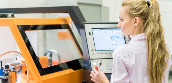 woman programming cnc machine