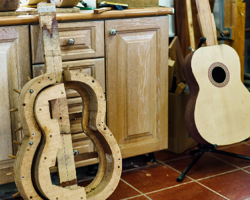 a wooden guitar mould that was crafted with a cnc router